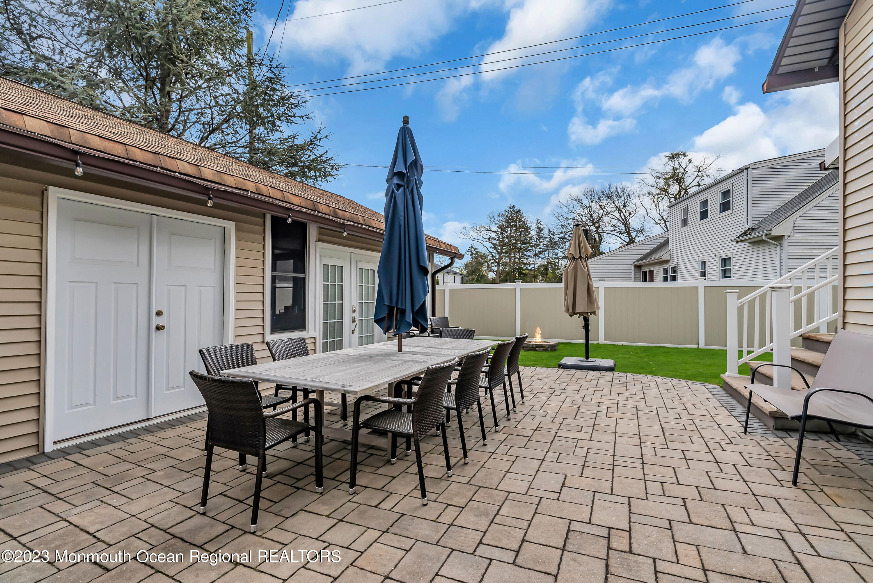515 Monmouth Road West Allenhurst, NJ 07711 - Photo 25 of 45 a view of a patio with a table and chairs