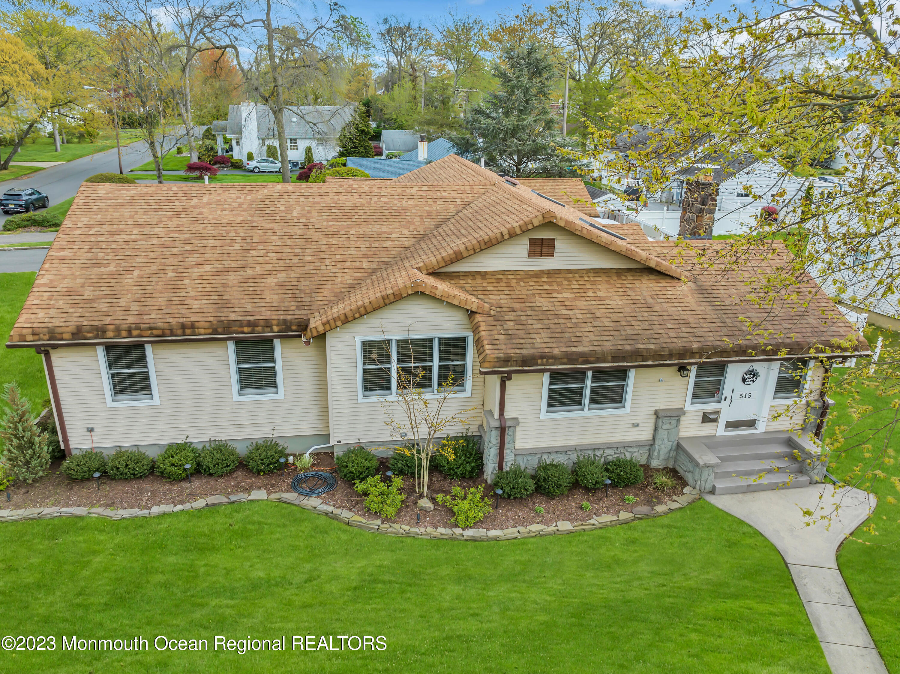 515 Monmouth Road West Allenhurst, NJ 07711 - Photo 30 of 45 a front view of a house with a yard potted plants and large tree