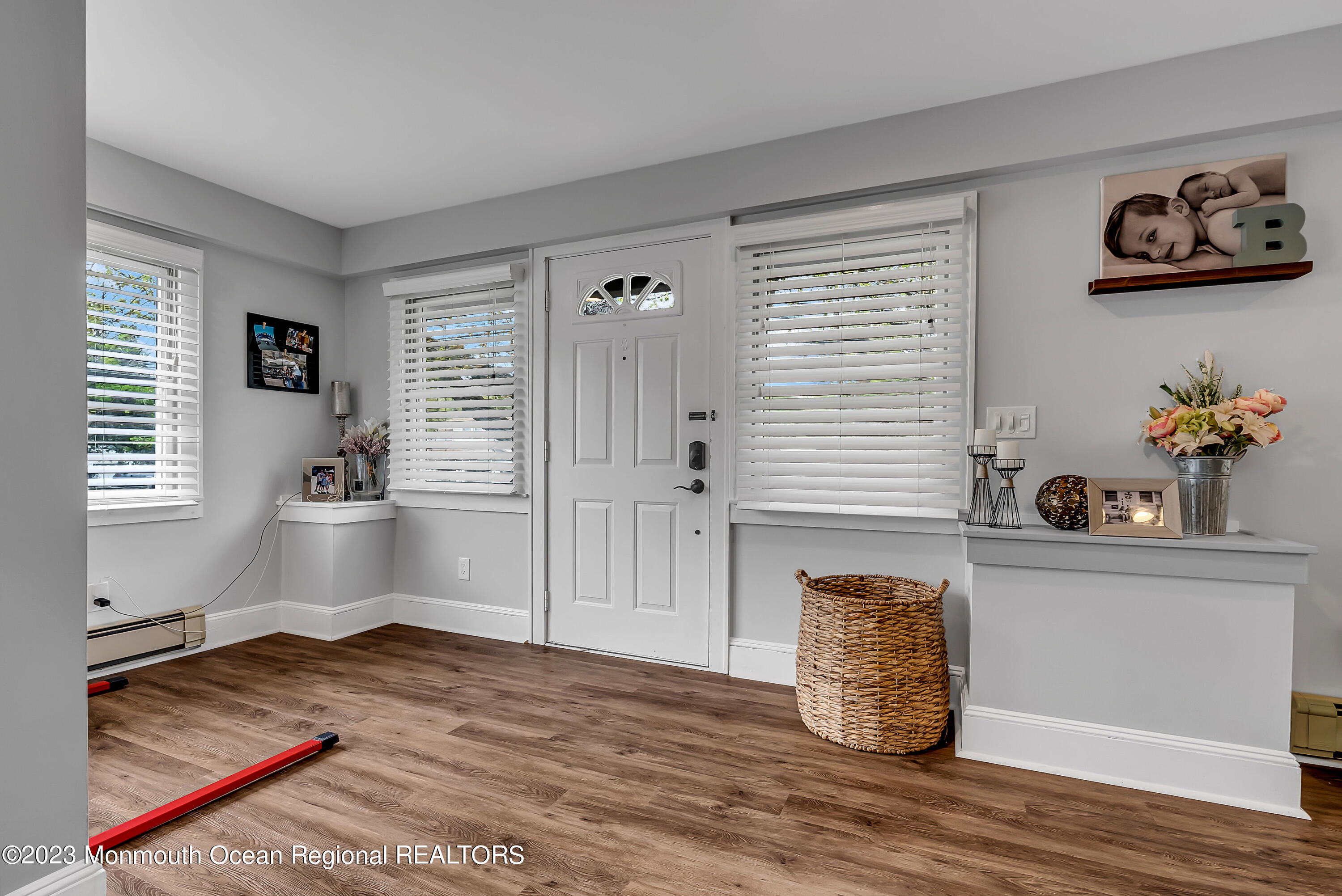 515 Monmouth Road West Allenhurst, NJ 07711 - Photo 36 of 45 a room with wooden floor and window