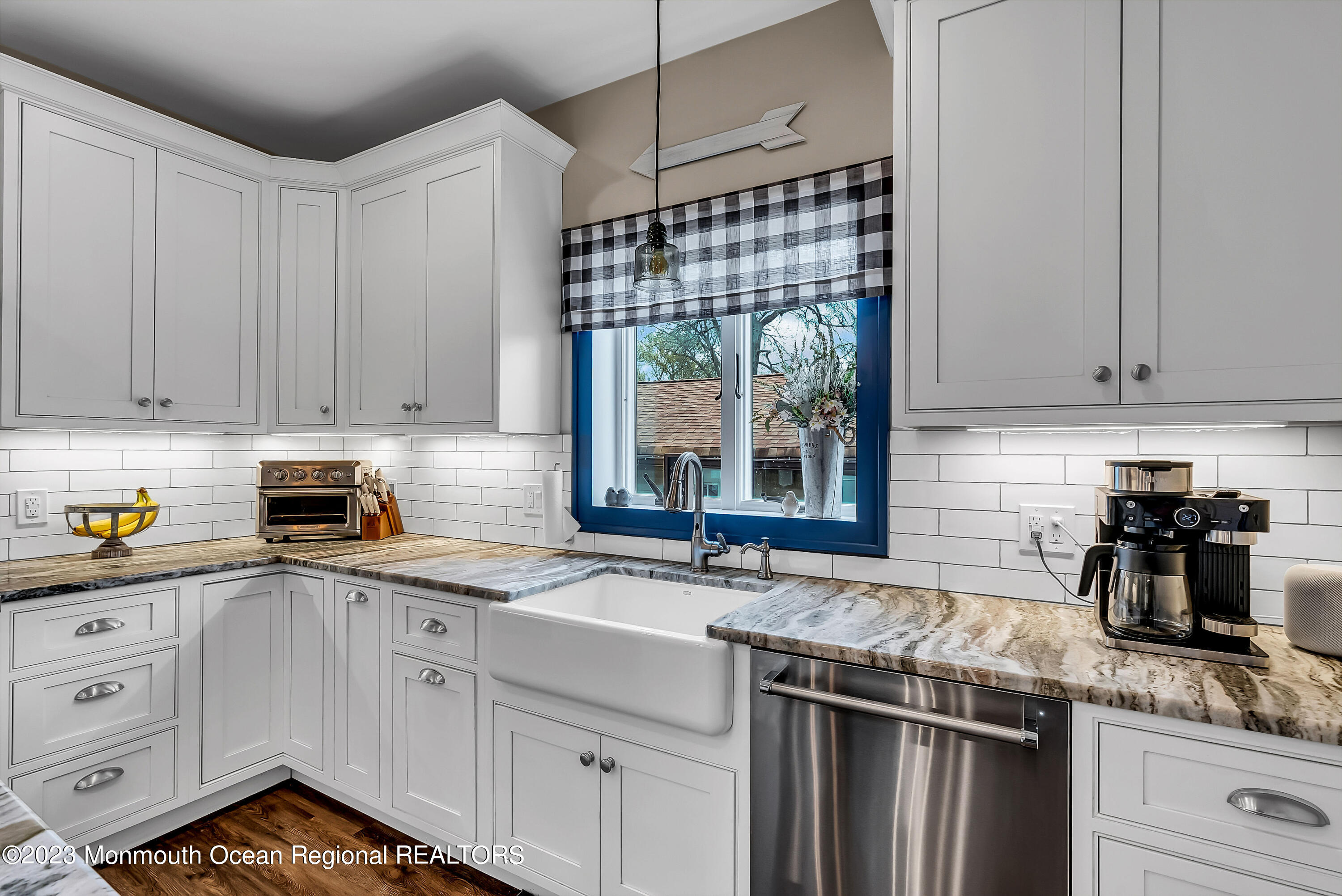 515 Monmouth Road West Allenhurst, NJ 07711 - Photo 5 of 45 a kitchen with a sink stove and cabinets