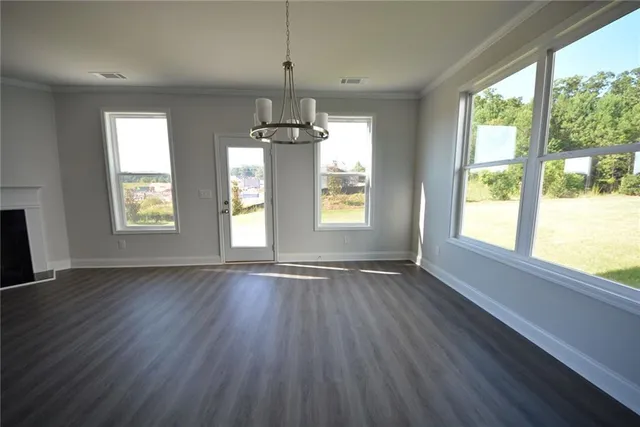 a view of a kitchen with microwave and cabinets