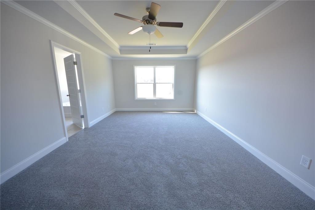 3871 Brookburn Park Gainesville, GA 30506 - Photo 20 of 28 an empty room with windows and a ceiling fan