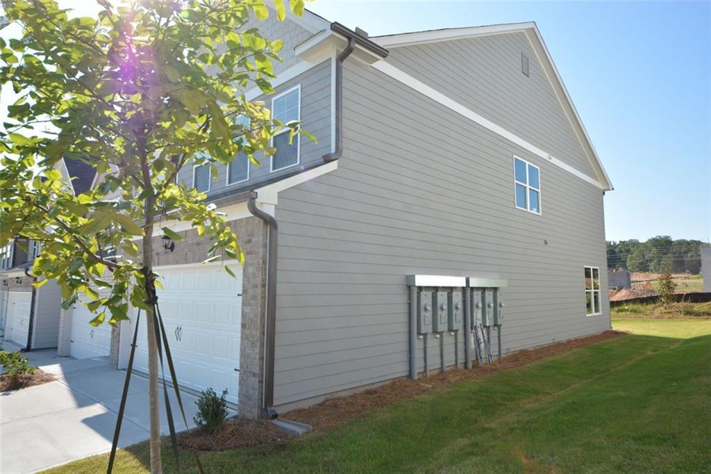 3871 Brookburn Park Gainesville, GA 30506 - Photo 2 of 28 a backyard of a house with table and chairs