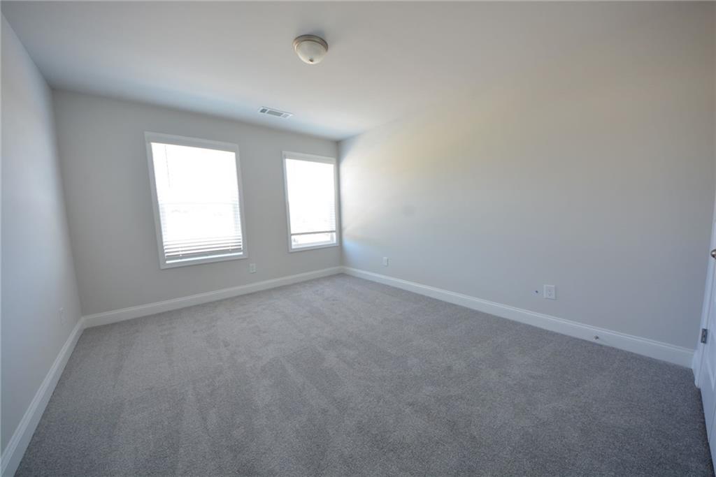3871 Brookburn Park Gainesville, GA 30506 - Photo 27 of 28 an empty room with windows