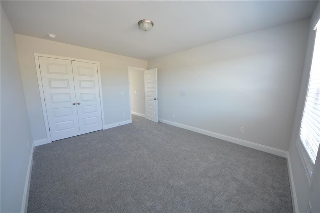 3871 Brookburn Park Gainesville, GA 30506 - Photo 28 of 28 an empty room with windows