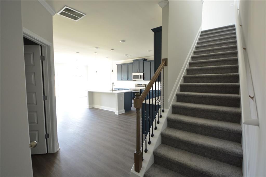 3871 Brookburn Park Gainesville, GA 30506 - Photo 6 of 28 a view of entryway and hall with wooden floor
