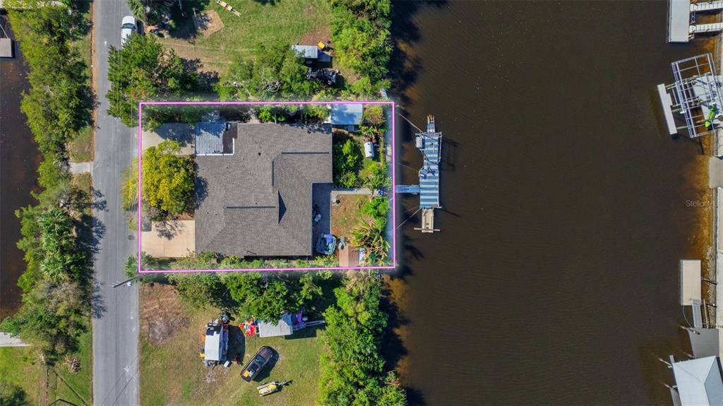 an aerial view of house with a yard