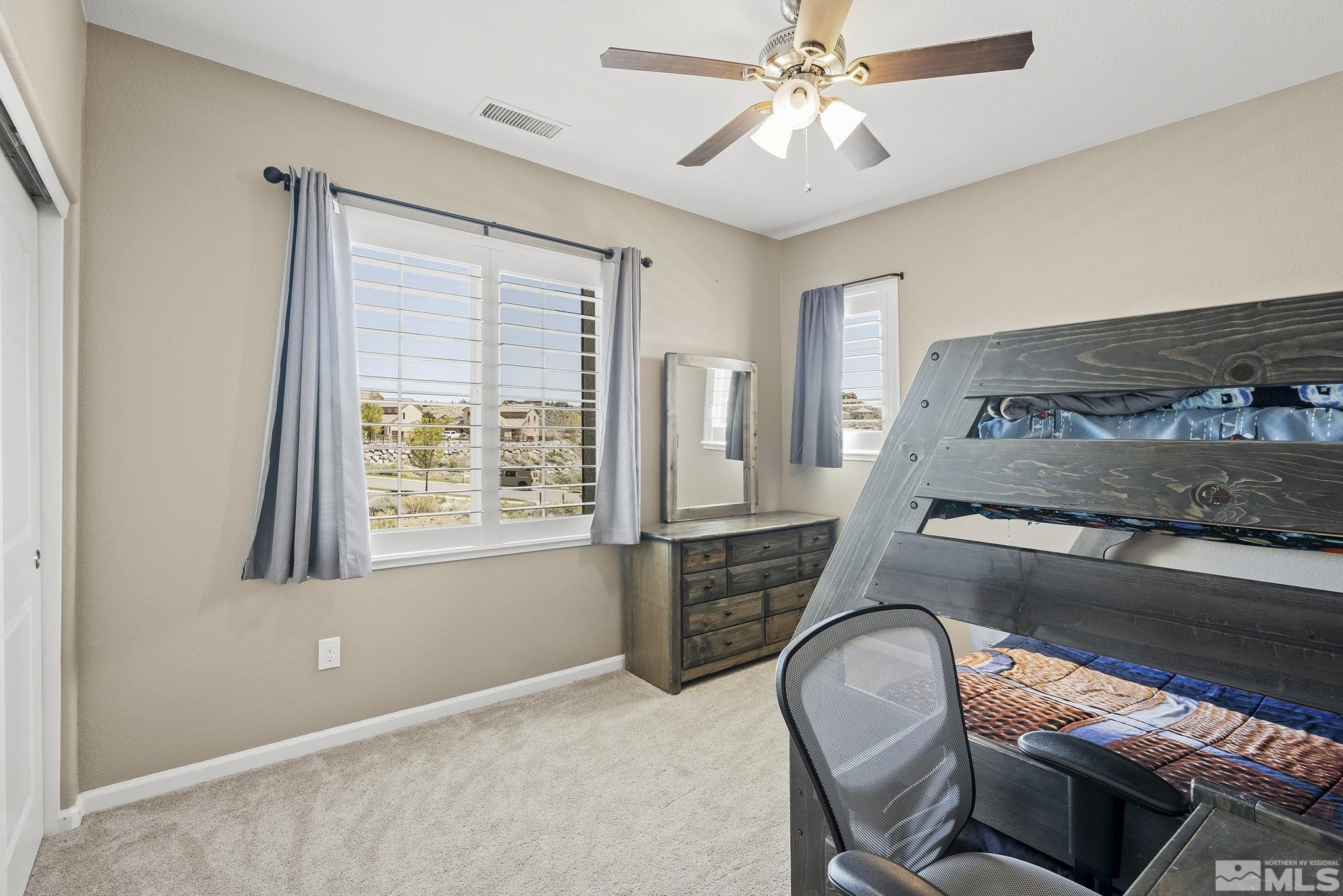 1653 Crescent Pointe Court Reno, NV 89523 - Photo 20 of 39 a bedroom with bed and window