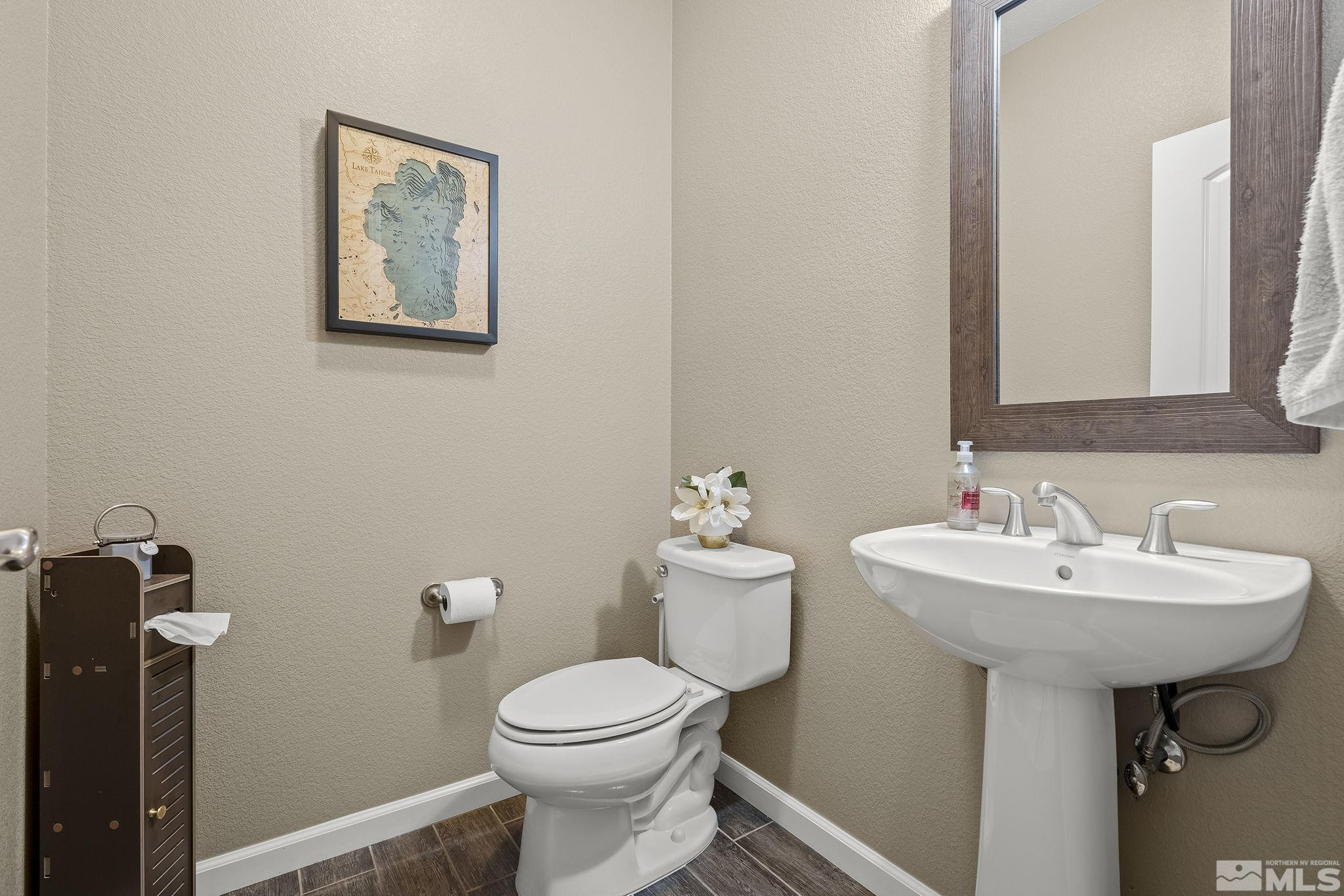 1653 Crescent Pointe Court Reno, NV 89523 - Photo 22 of 39 a bathroom with a sink mirror and toilet