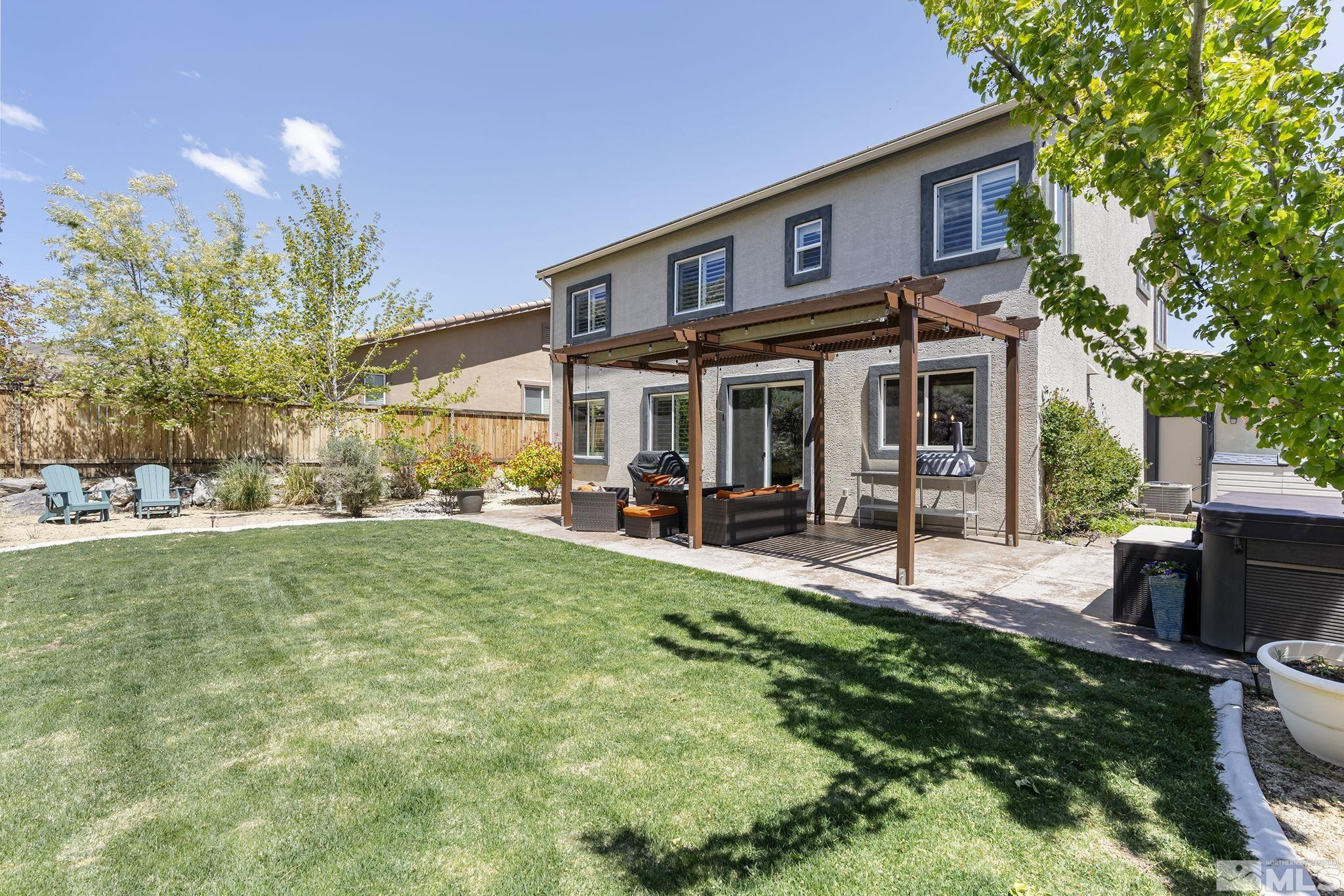 1653 Crescent Pointe Court Reno, NV 89523 - Photo 25 of 39 a view of a house with a yard porch and sitting area
