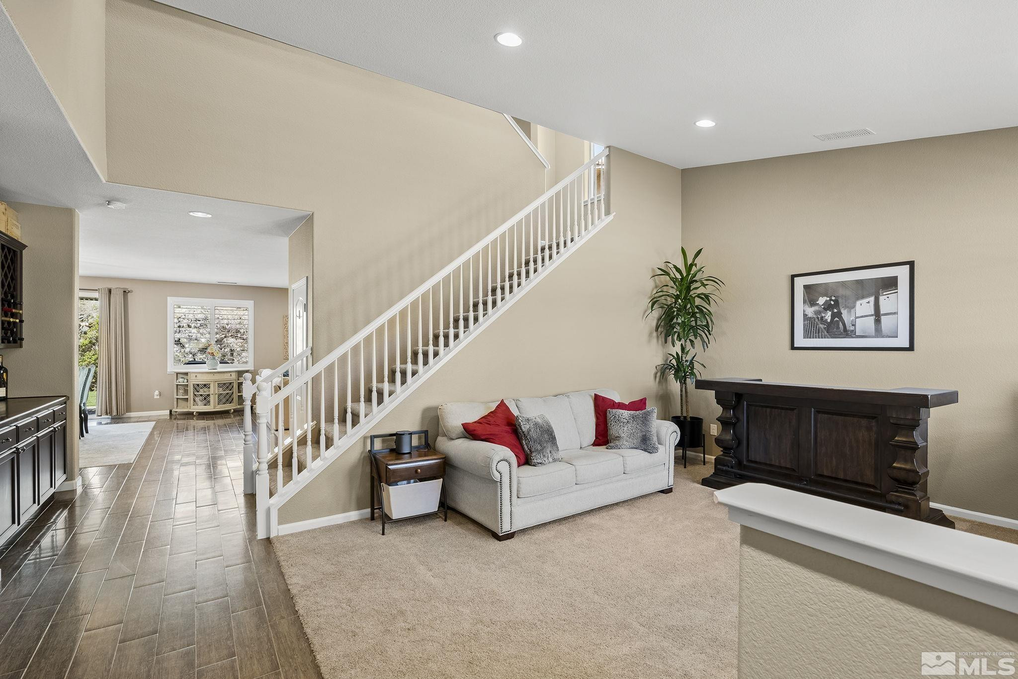 1653 Crescent Pointe Court Reno, NV 89523 - Photo 3 of 39 a living room with furniture and a couch