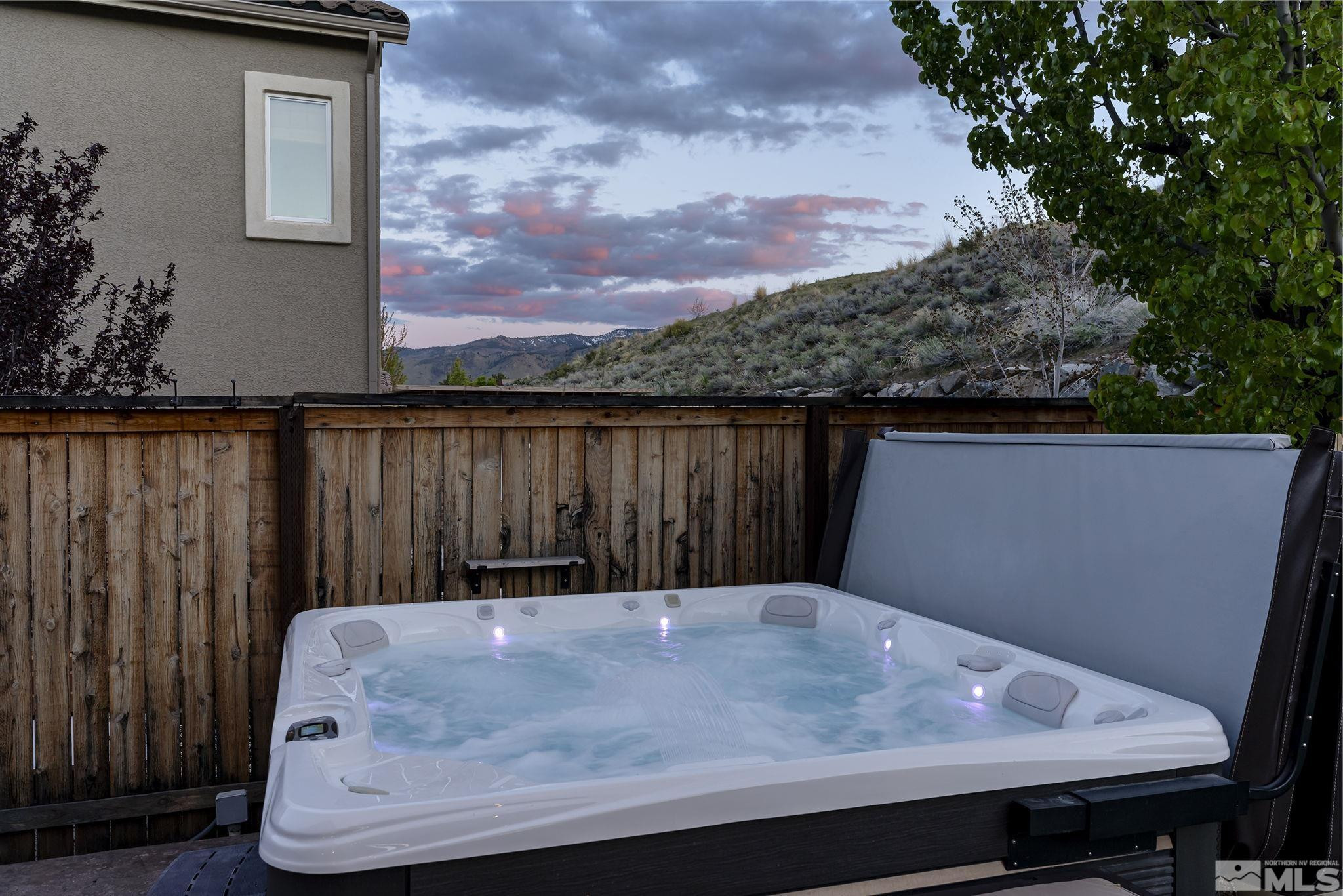 1653 Crescent Pointe Court Reno, NV 89523 - Photo 31 of 39 a wooden bench sitting in front of a house