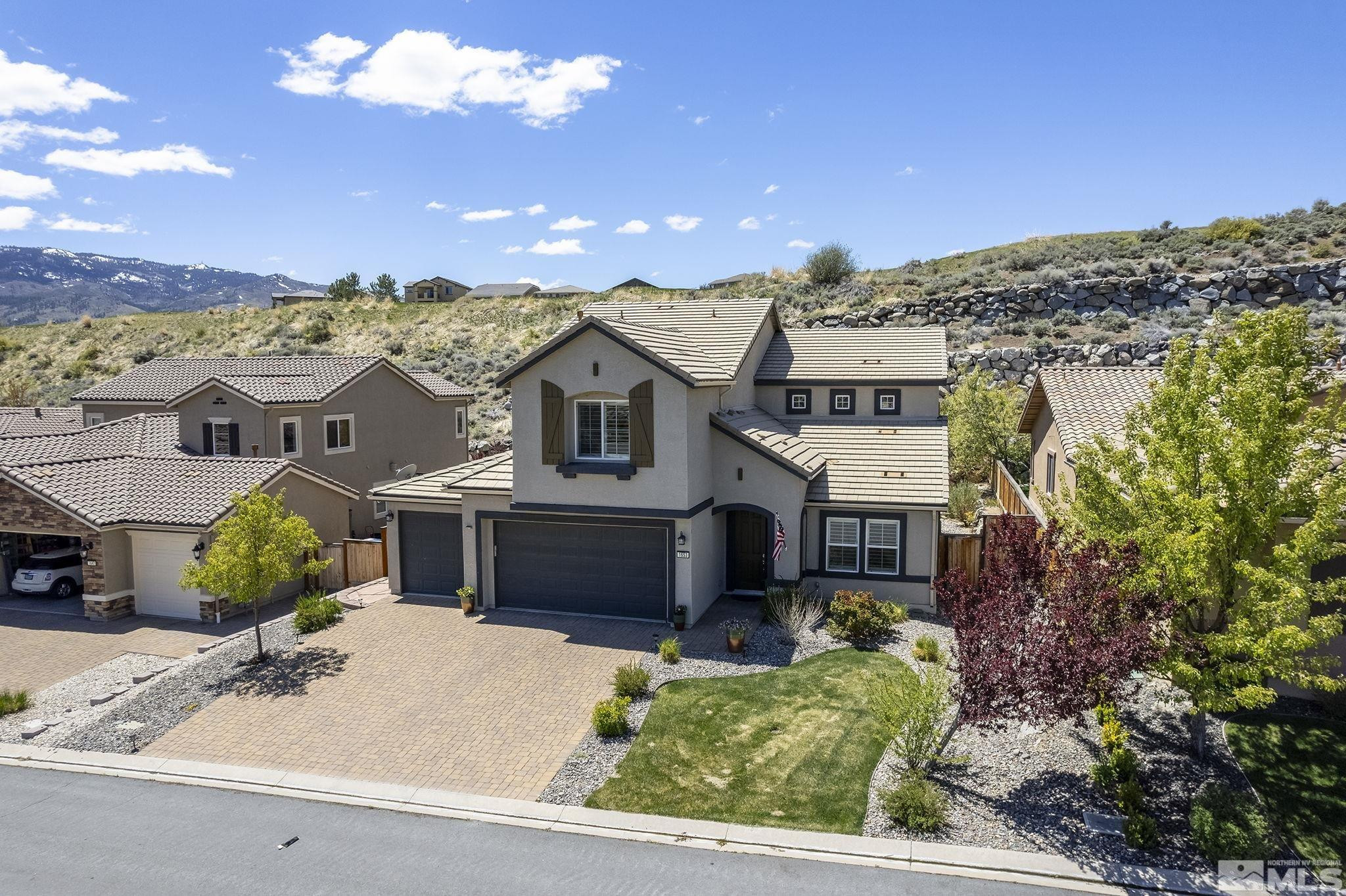 1653 Crescent Pointe Court Reno, NV 89523 - Photo 33 of 39 front view of a house with a yard