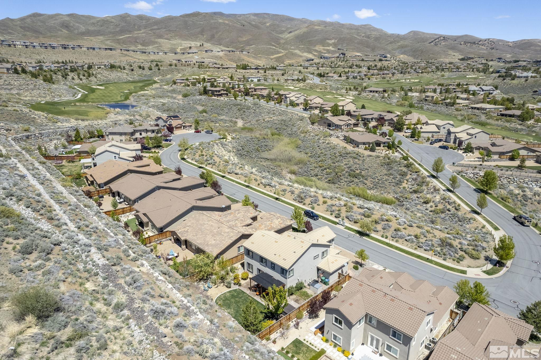 1653 Crescent Pointe Court Reno, NV 89523 - Photo 38 of 39 an aerial view of residential house and sandy dunes