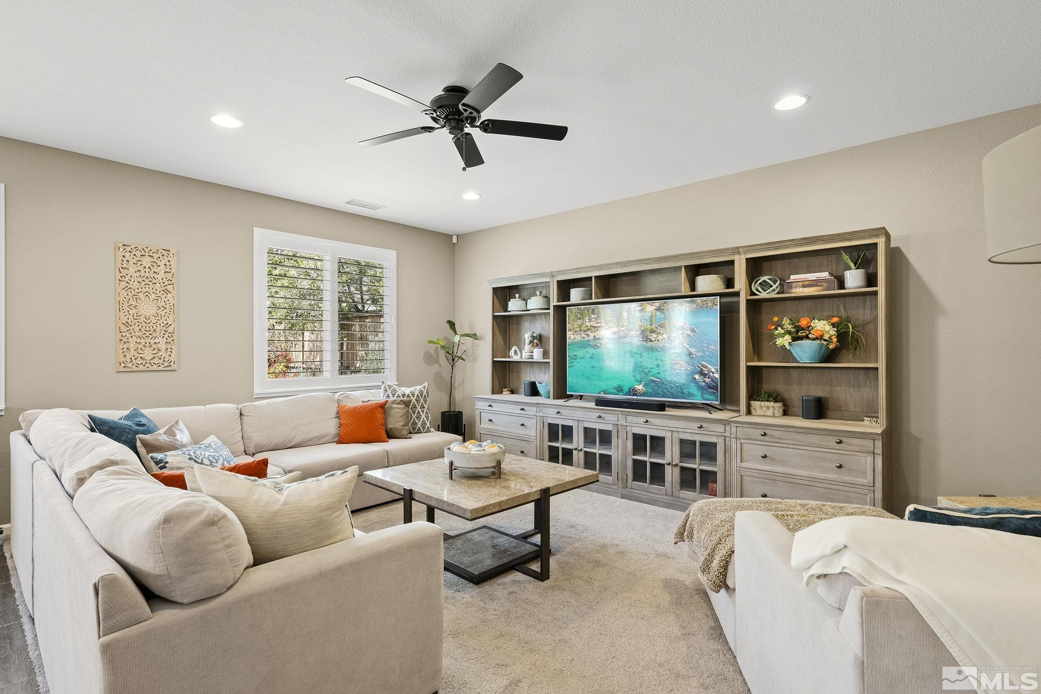1653 Crescent Pointe Court Reno, NV 89523 - Photo 5 of 39 a living room with furniture and a flat screen tv