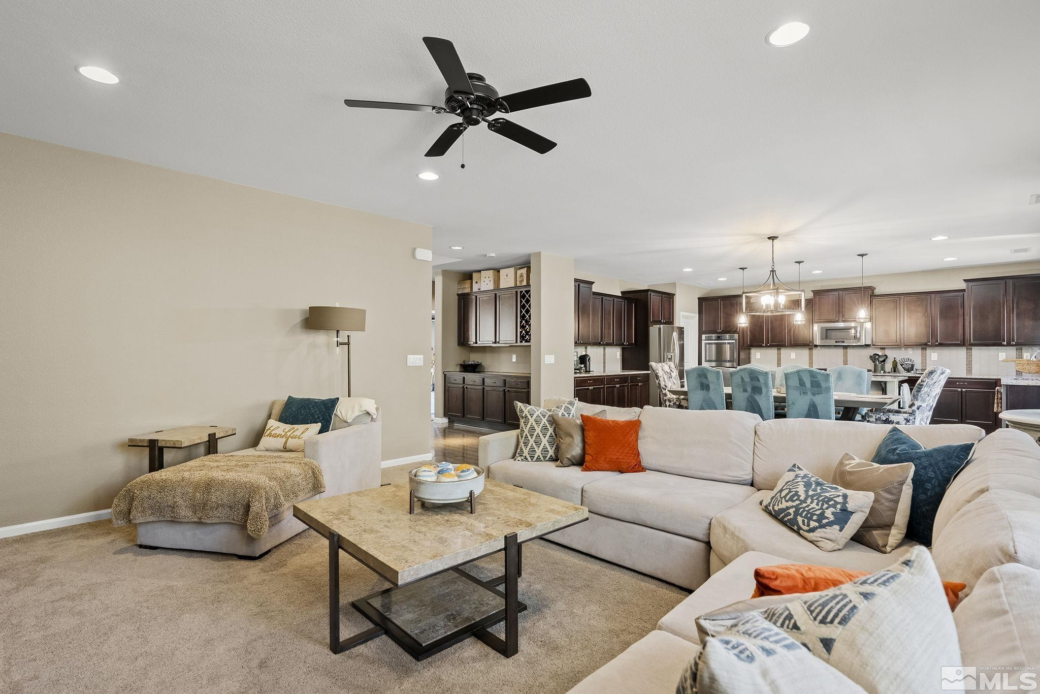 1653 Crescent Pointe Court Reno, NV 89523 - Photo 7 of 39 a living room with furniture and a view of kitchen