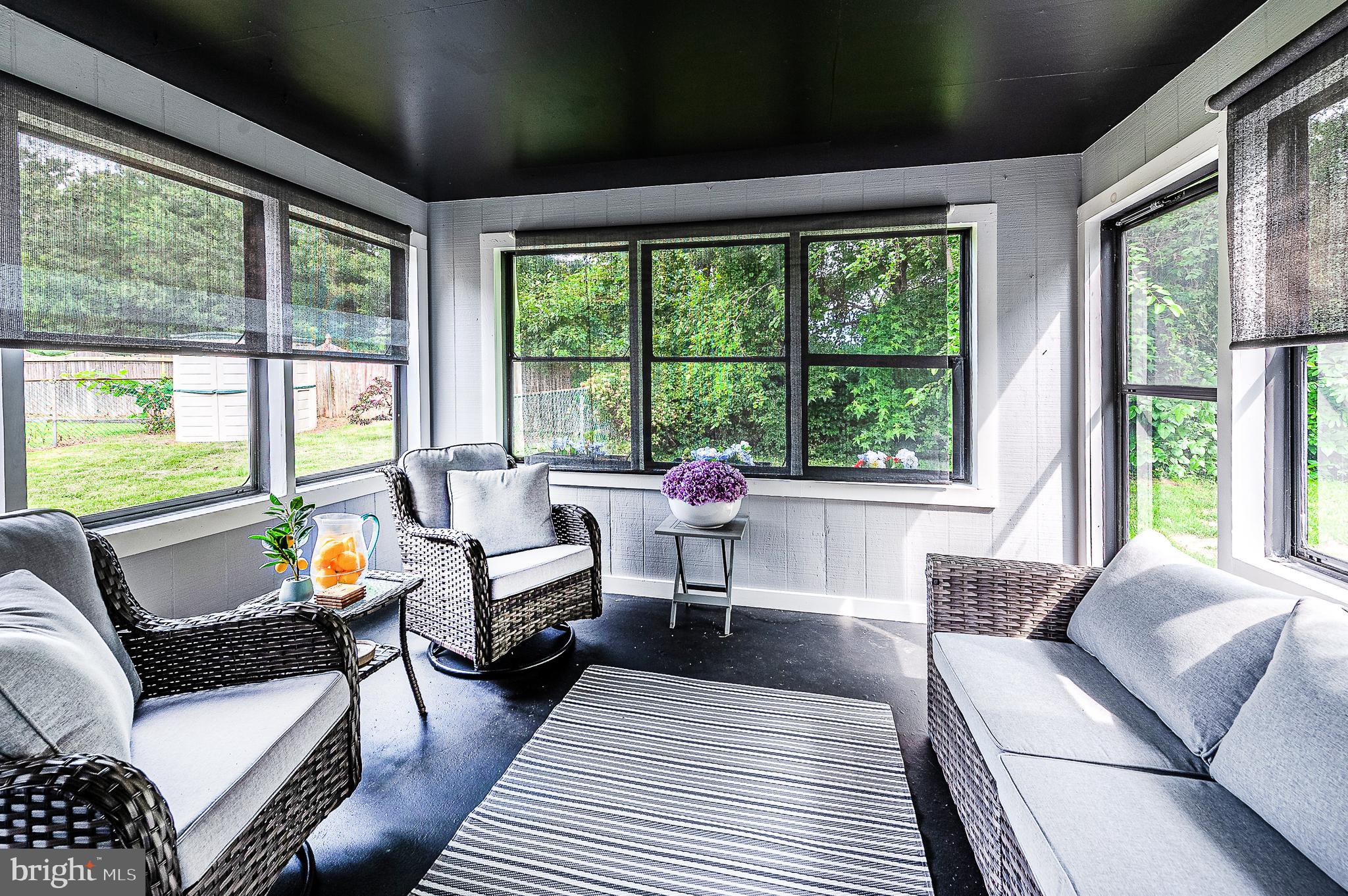 102 Brookdale Place Clementon, NJ 08021 - Photo 16 of 25 a living room with furniture and floor to ceiling windows