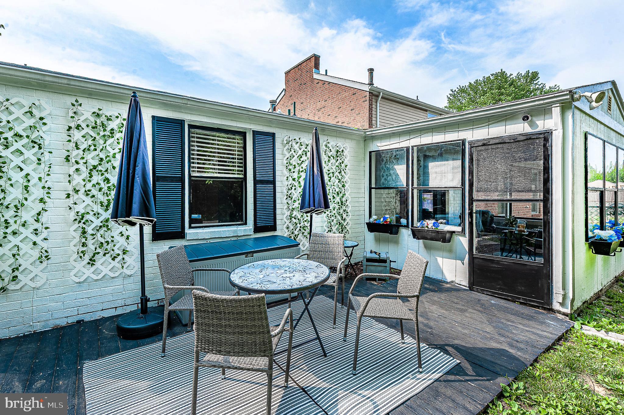 102 Brookdale Place Clementon, NJ 08021 - Photo 18 of 25 a view of a patio with table and chairs and potted plants