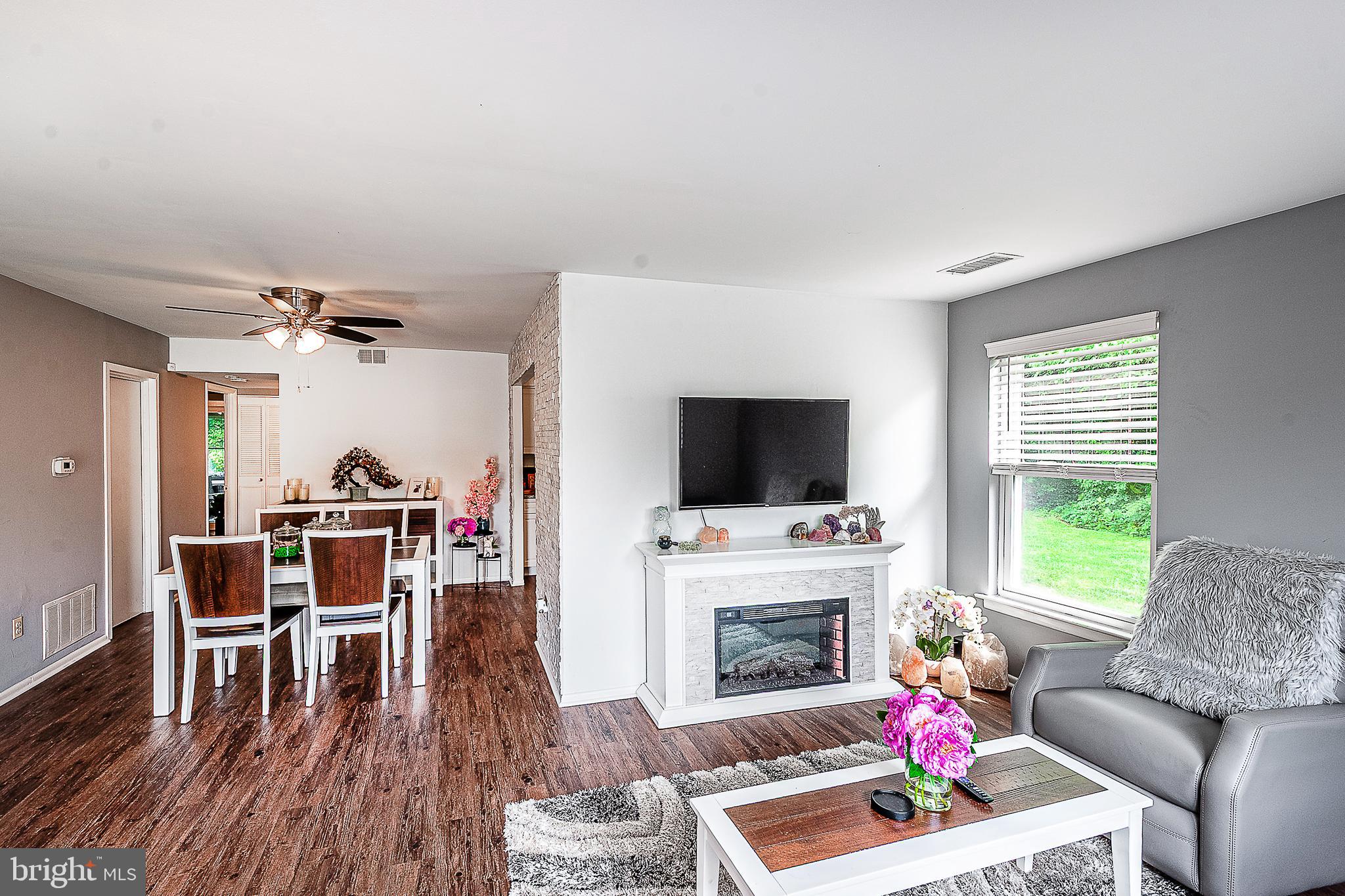 102 Brookdale Place Clementon, NJ 08021 - Photo 5 of 25 a living room with furniture fireplace and flat screen tv
