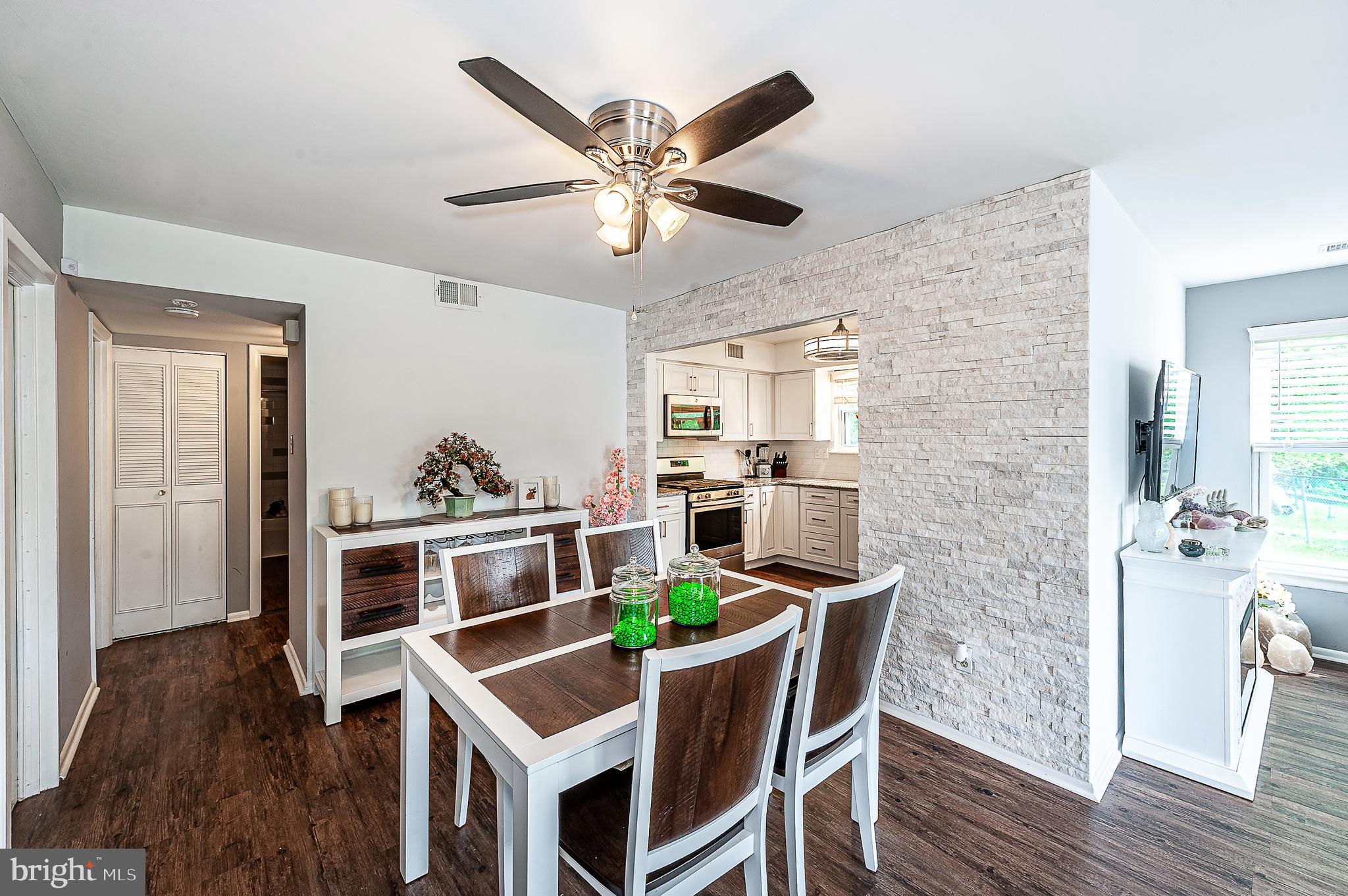 102 Brookdale Place Clementon, NJ 08021 - Photo 6 of 25 a view of a dining room with furniture and wooden floor