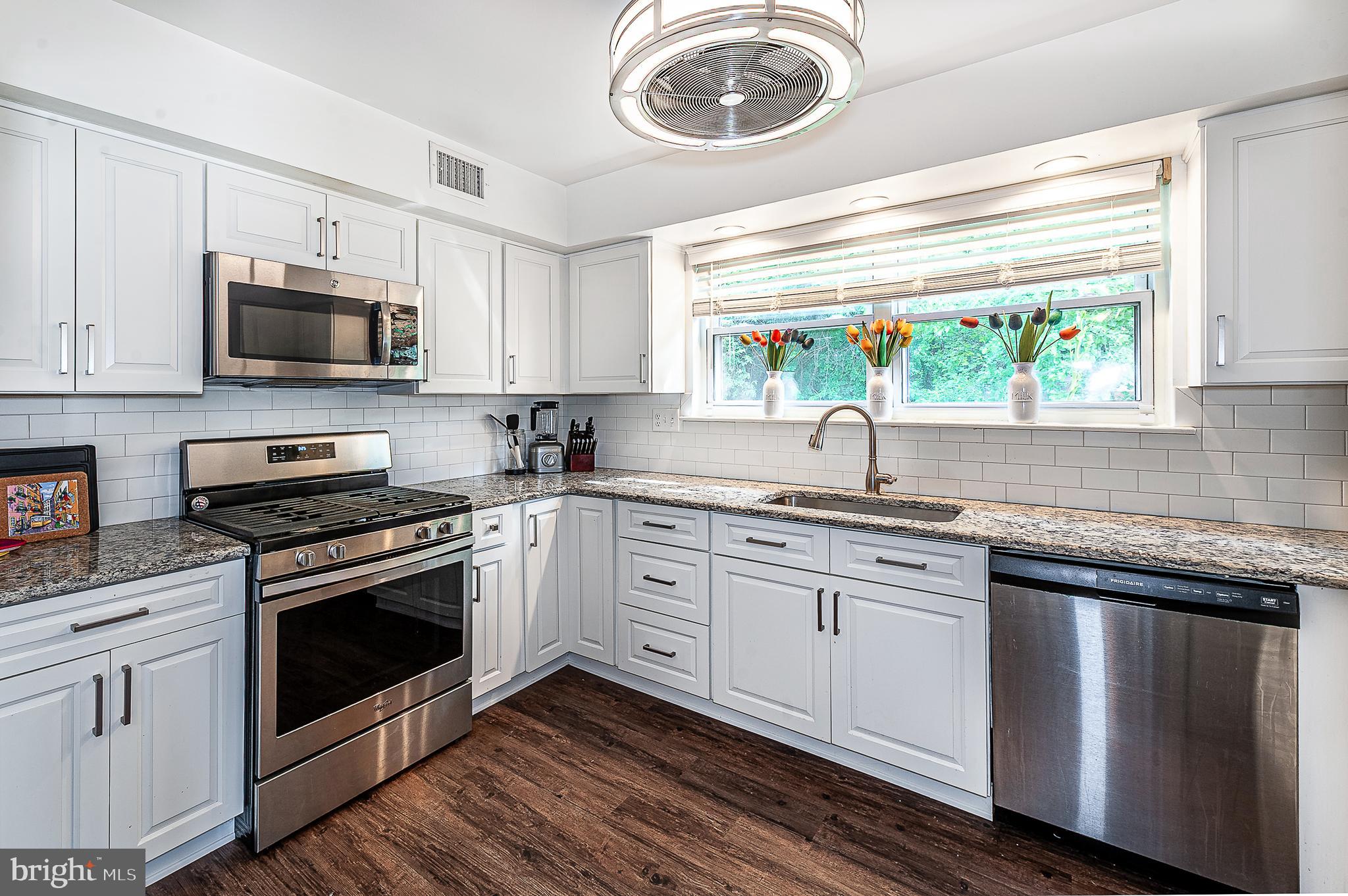 102 Brookdale Place Clementon, NJ 08021 - Photo 9 of 25 a kitchen with stainless steel appliances granite countertop a stove and a sink