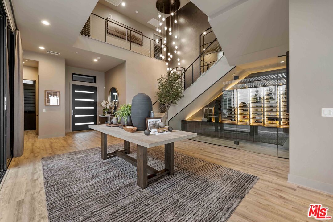 20524 Shelley Lane Porter Ranch, CA 91326 - Photo 15 of 73 a view of entryway livingroom and hall with wooden floor
