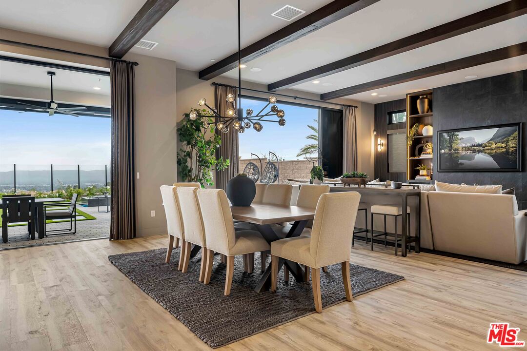 20524 Shelley Lane Porter Ranch, CA 91326 - Photo 17 of 73 a dining room with furniture and wooden floor