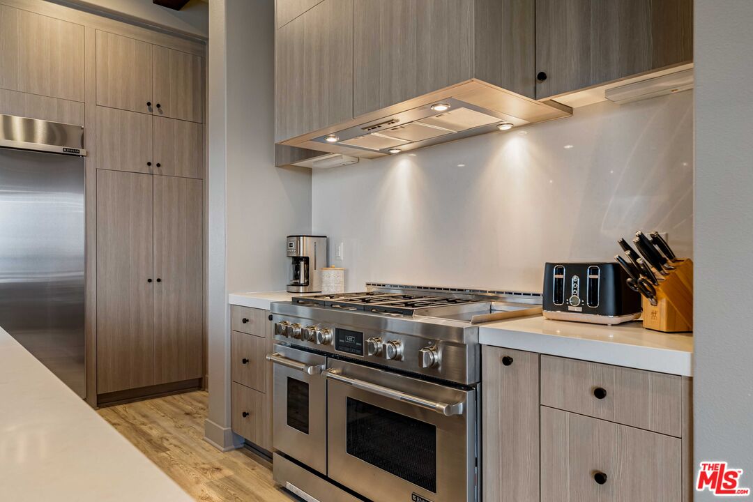 20524 Shelley Lane Porter Ranch, CA 91326 - Photo 22 of 73 a kitchen with a stove and a microwave