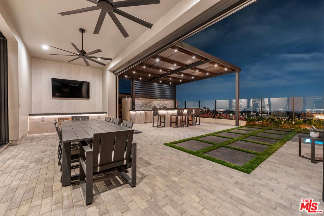 20524 Shelley Lane Porter Ranch, CA 91326 - Photo 27 of 73 a living room with lots of furniture and a clock