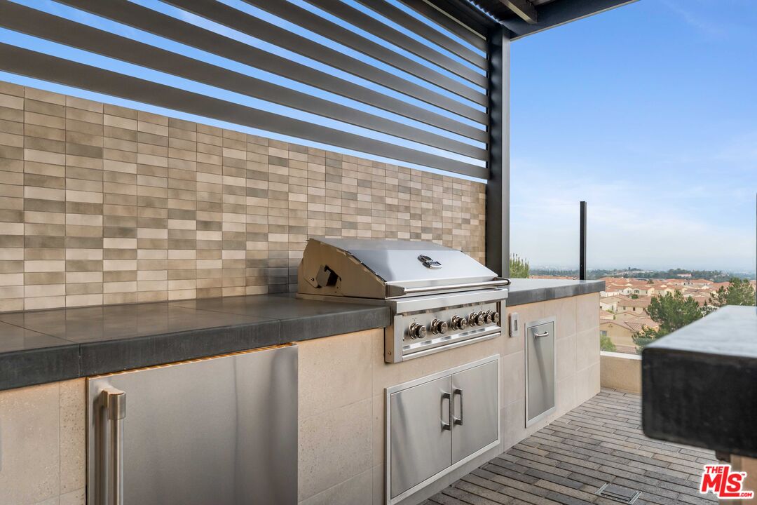 20524 Shelley Lane Porter Ranch, CA 91326 - Photo 30 of 73 a kitchen with a stove and a sink
