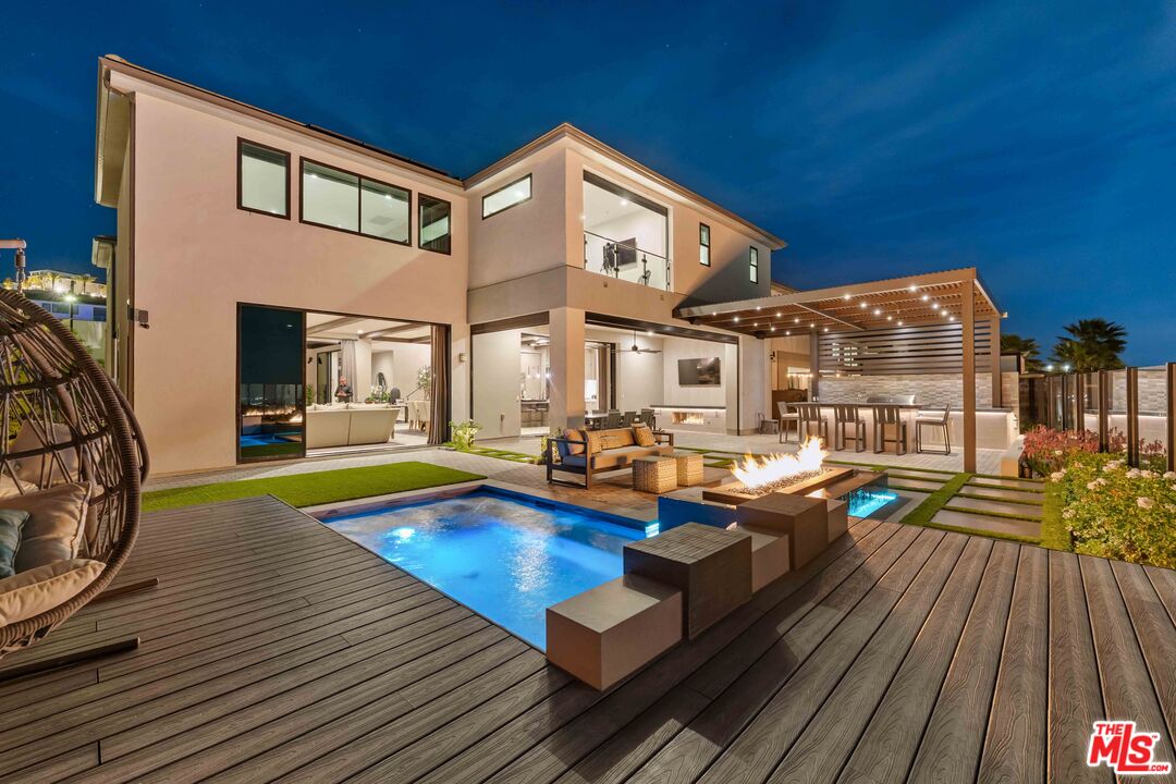 20524 Shelley Lane Porter Ranch, CA 91326 - Photo 3 of 73 a view of pool with chairs and wooden floor