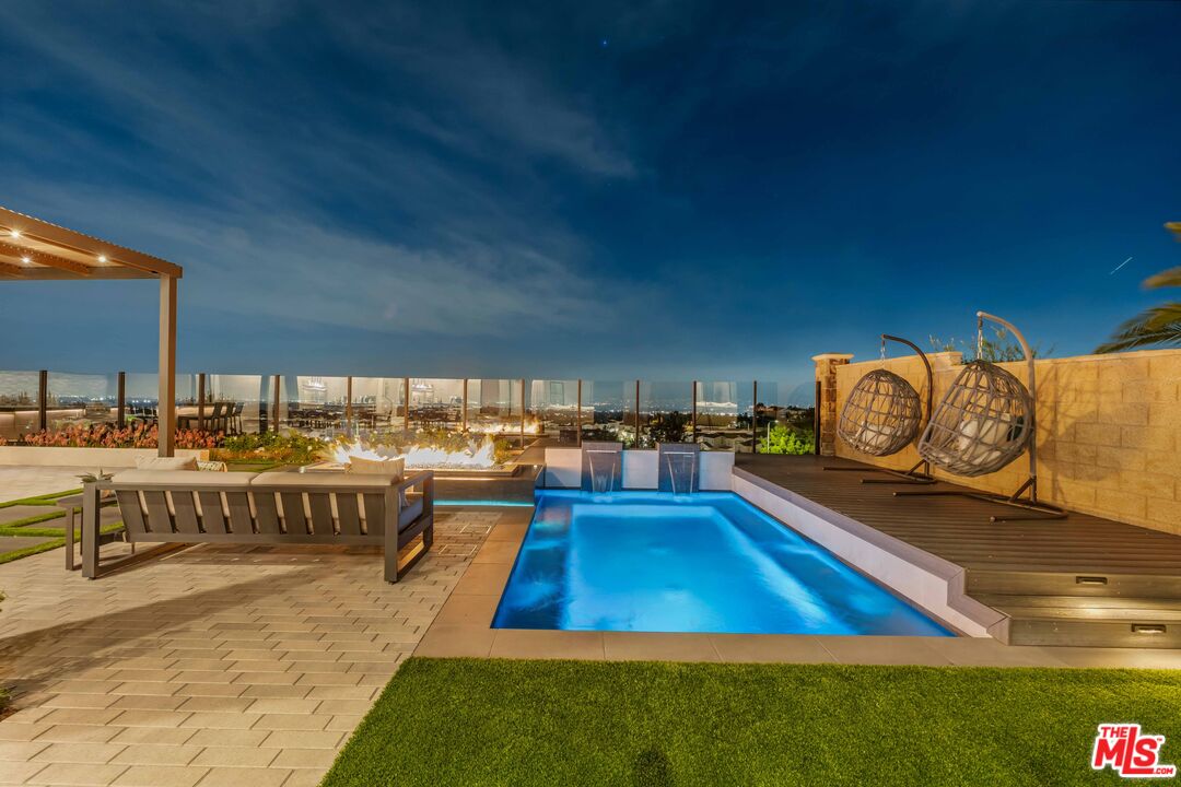 20524 Shelley Lane Porter Ranch, CA 91326 - Photo 34 of 73 a living room with a couch and a table