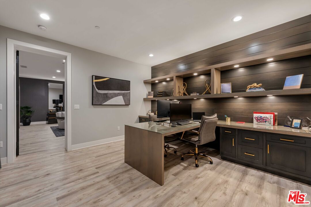 20524 Shelley Lane Porter Ranch, CA 91326 - Photo 44 of 73 a kitchen with cabinets and wooden floor