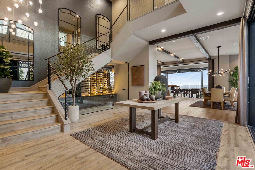 20524 Shelley Lane Porter Ranch, CA 91326 - Photo 5 of 73 a living room with fireplace furniture and a wooden floor