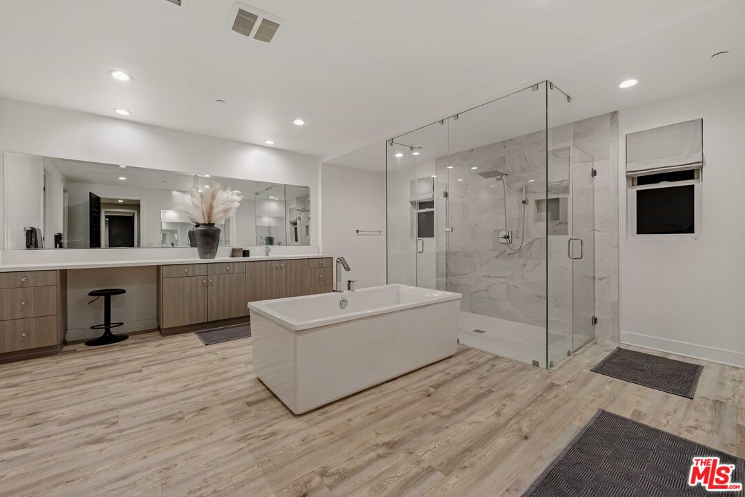 20524 Shelley Lane Porter Ranch, CA 91326 - Photo 51 of 73 a large white bathroom with a double vanity sink mirror and shower