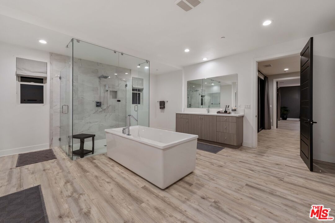 20524 Shelley Lane Porter Ranch, CA 91326 - Photo 52 of 73 a large white room with a large mirror and furniture
