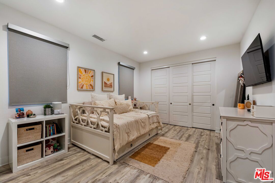 20524 Shelley Lane Porter Ranch, CA 91326 - Photo 58 of 73 a bedroom with a bed and a flat screen tv