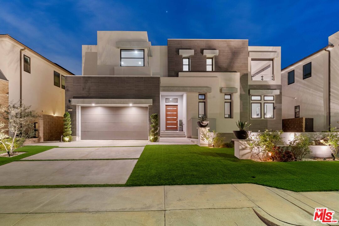 20524 Shelley Lane Porter Ranch, CA 91326 - Photo 60 of 73 a front view of a house with garden