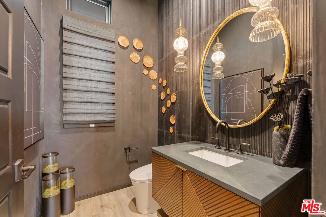 20524 Shelley Lane Porter Ranch, CA 91326 - Photo 6 of 73 a bathroom with a sink and a mirror