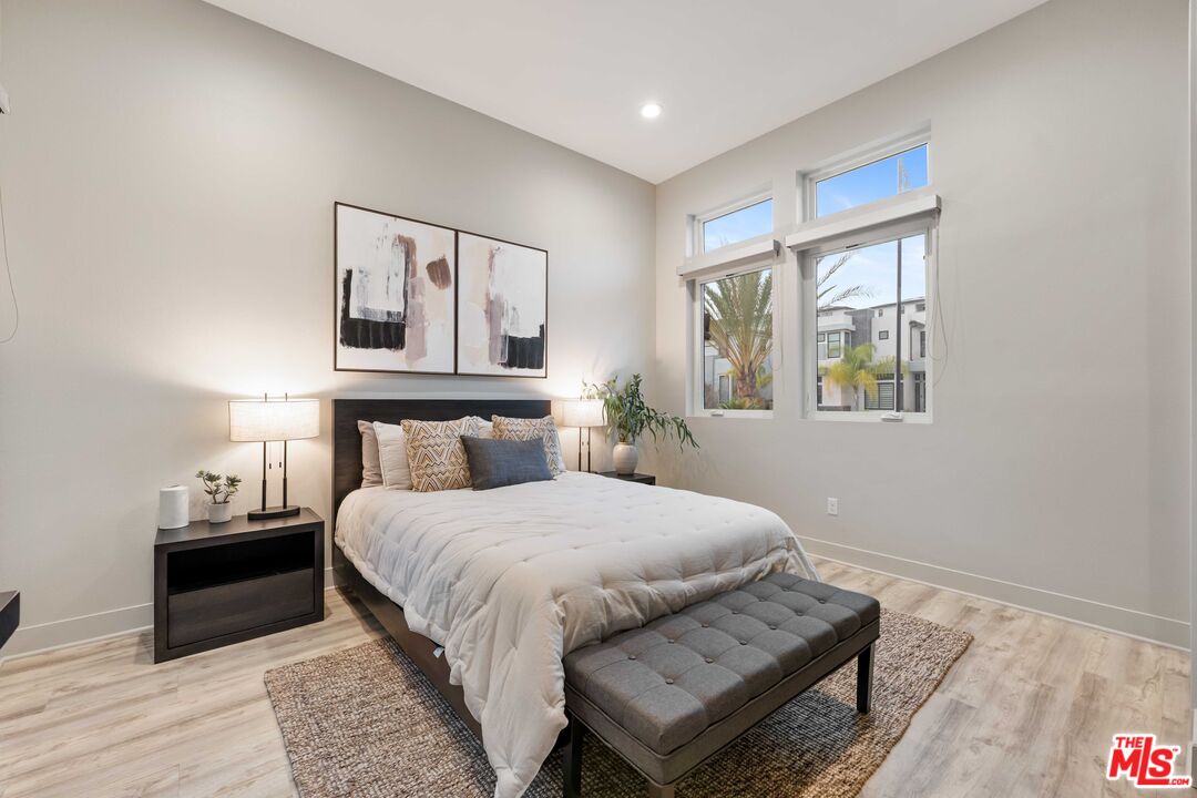 20524 Shelley Lane Porter Ranch, CA 91326 - Photo 8 of 73 a bedroom with a bed and wooden floor