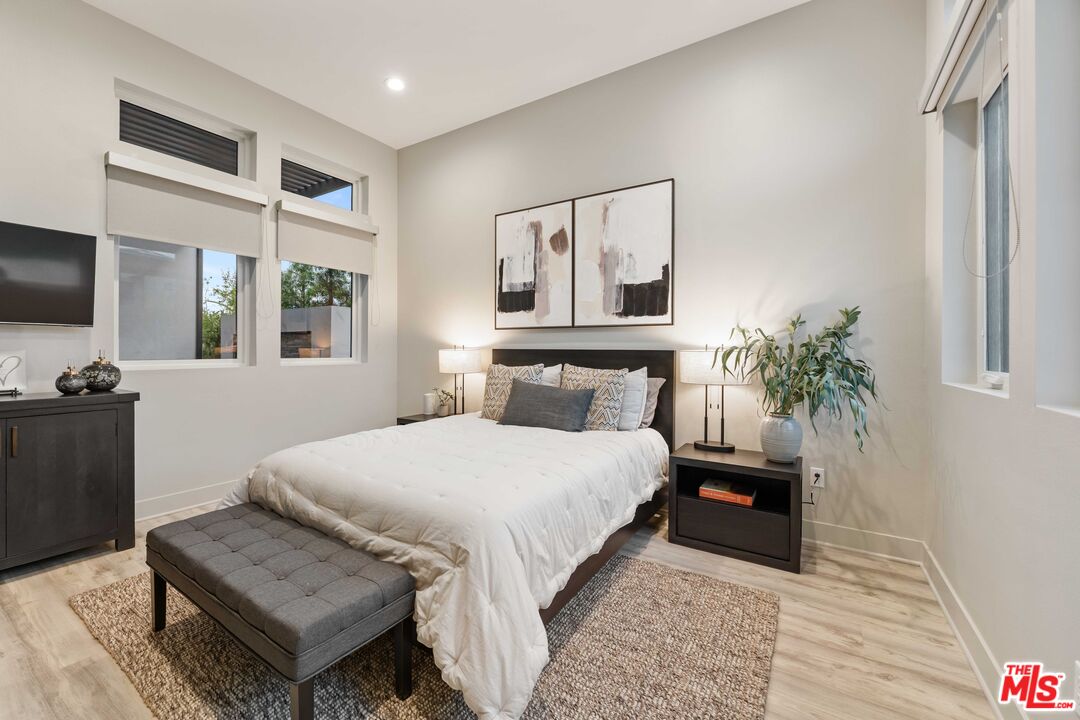 20524 Shelley Lane Porter Ranch, CA 91326 - Photo 9 of 73 a bedroom with a bed window and flat screen tv