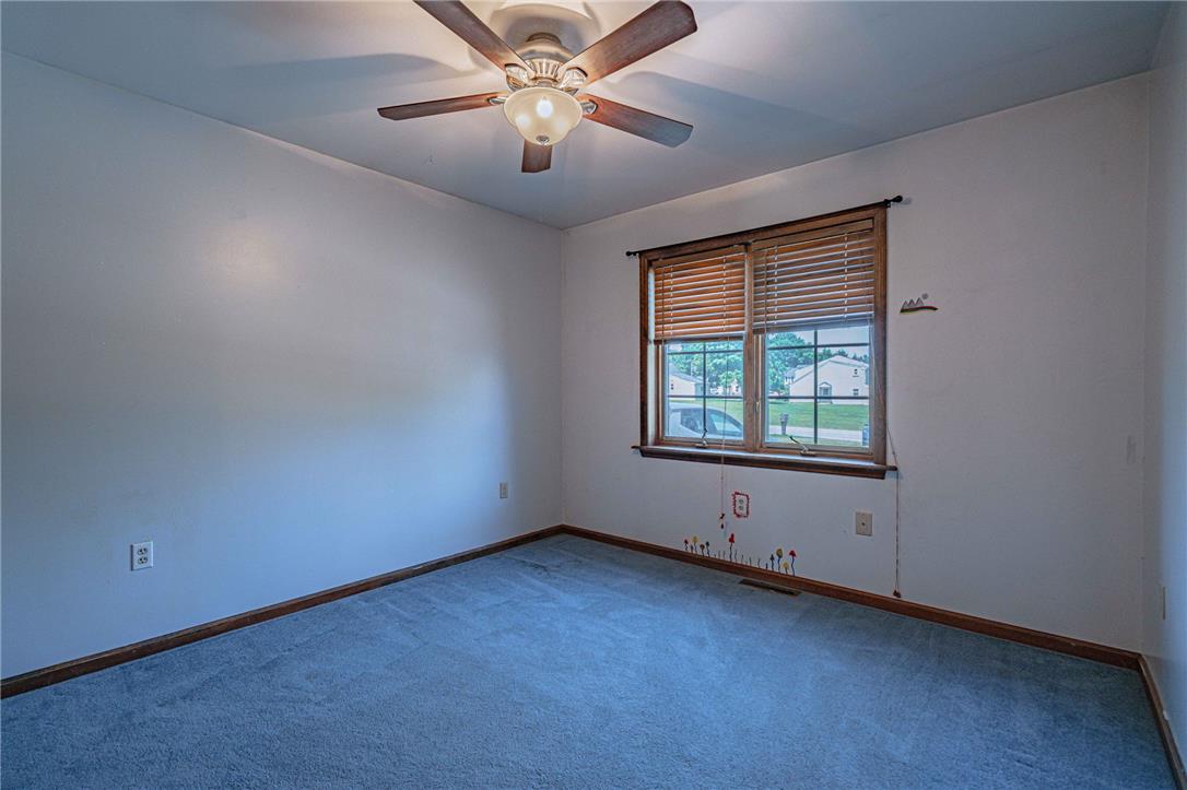 652 Old State Road Oley, PA 19547 - Photo 30 of 54 A comfortable bedroom features plush carpeting and a convenient ceiling fan.