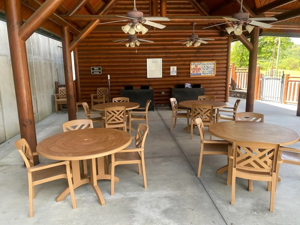 1663 Mountain Lodge Way Sevierville, TN 37862 - Photo 23 of 24 a dinning table and chairs in the patio of the house