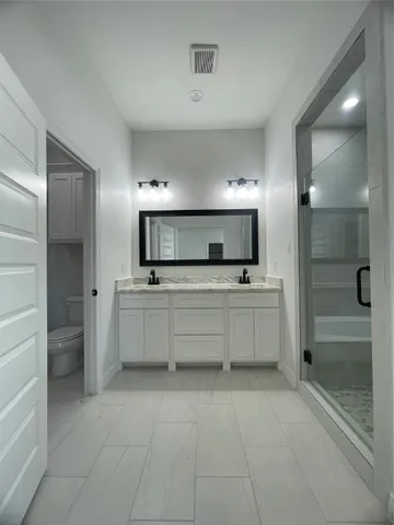a bathroom with a bathtub and shower