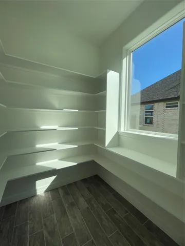 a view of a room and kitchen