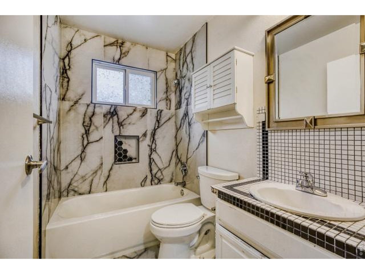 10748 Routt Street Broomfield, CO 80021 - Photo 12 of 30 a bathroom with a granite countertop toilet sink and mirror