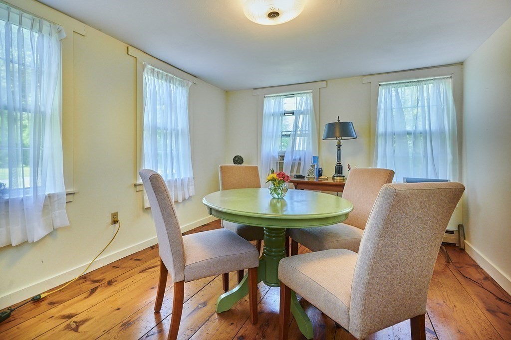 416 Bay Road Amherst, MA 01002 - Photo 12 of 42 a view of a dining room with furniture and window