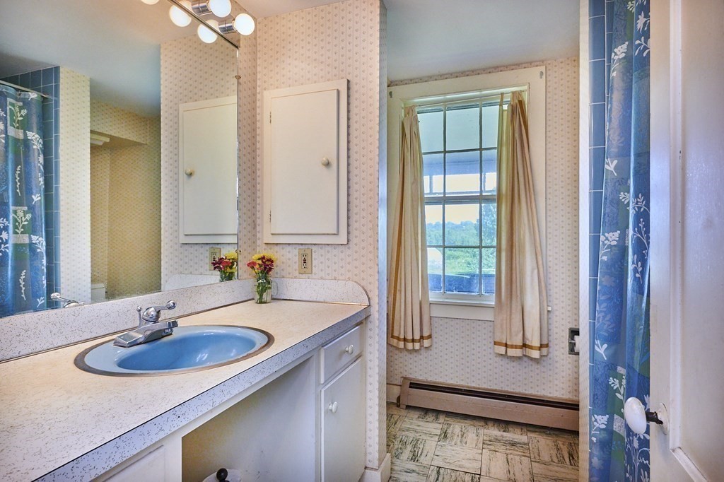 416 Bay Road Amherst, MA 01002 - Photo 13 of 42 a bathroom with a sink and a mirror