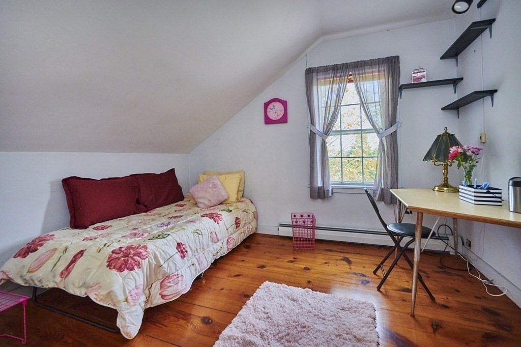 416 Bay Road Amherst, MA 01002 - Photo 15 of 42 a bedroom with a bed and a table in it