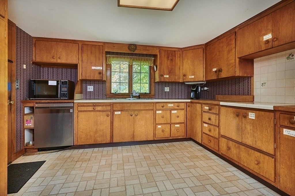 416 Bay Road Amherst, MA 01002 - Photo 17 of 42 a kitchen with stainless steel appliances granite countertop a stove a sink and a microwave